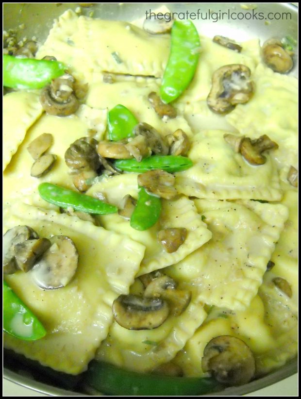 Ravioli with mushrooms and snap peas is heated through and ready to garnish, then seve.