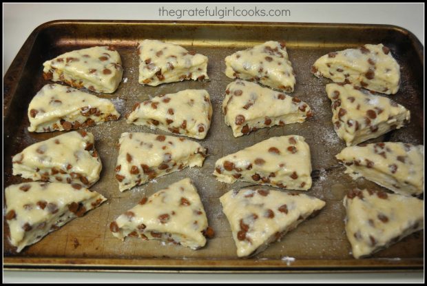 Cinnamon Chip Scones are cut into wedges, and placed on cookie sheet to bake.