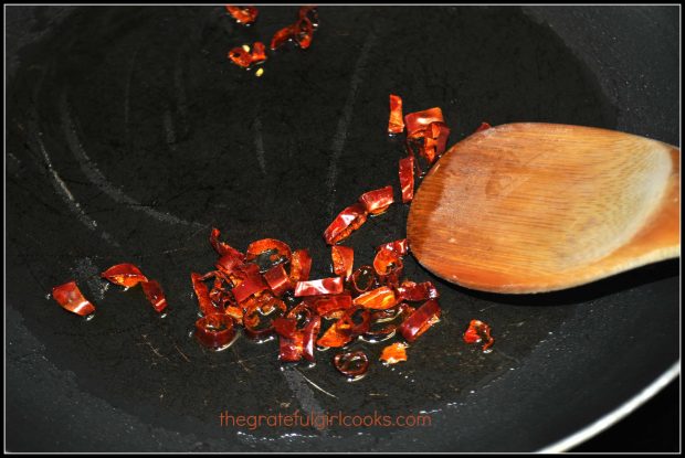 Red chili pepper slices are cooked for kung pao chicken.