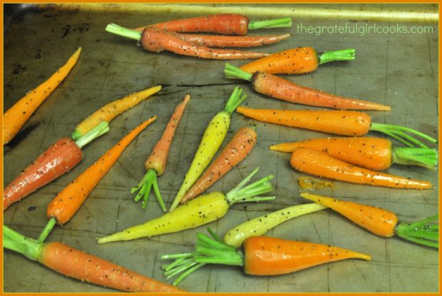 The oven-roasted carrots are cooked in single layer on baking sheet,