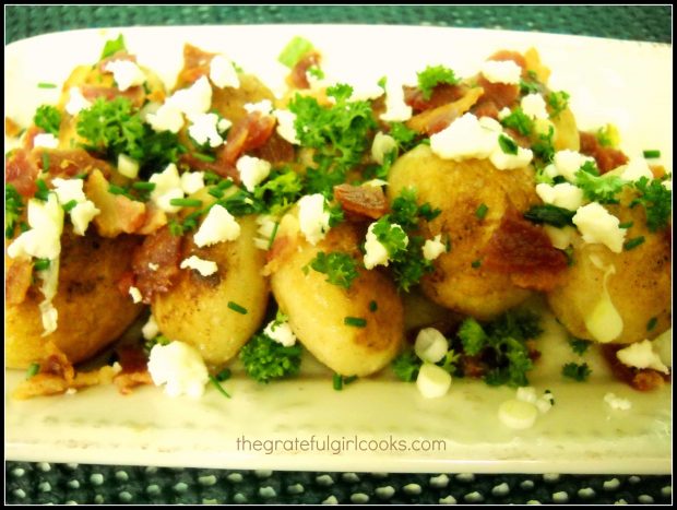 The finished rissole potatoes are garnished with feta, parsley, and crisp bacon.