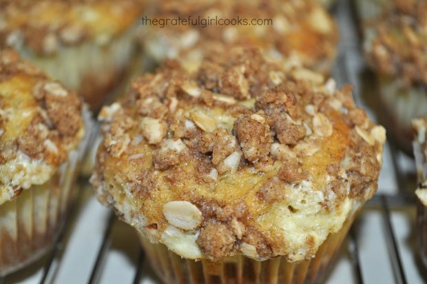 Banana muffins with crumb topping on wire rack