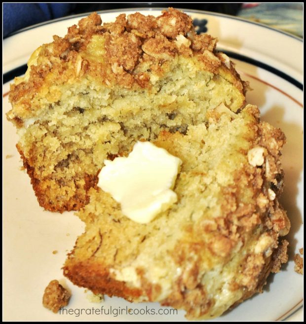 Banana crumb muffins cut in half with butter inside