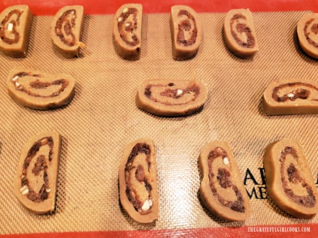 Date Roll Cookies - The Grateful Girl Cooks! Date roll cookies are sliced into portions and placed on cookie sheet for baking.