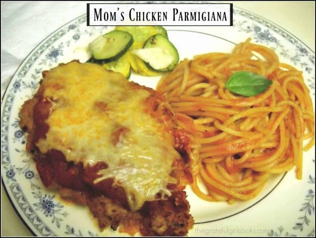 Mom's Chicken Parmigiana is a classic dish! Breaded chicken breasts are browned, then baked, topped w/ Italian sauce, Parmesan and mozzarella cheeses!