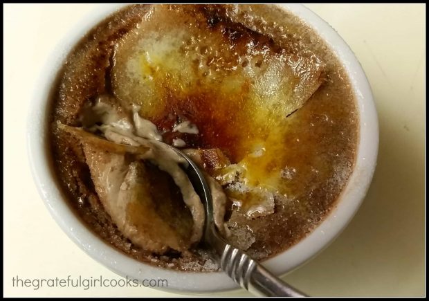 Cracking through the sugar crust, to see the chocolate creme brulee underneath.