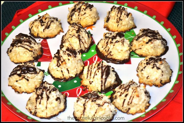 Chocolate-dipped coconut macaroons, ready to eat, on a Christmas plate.