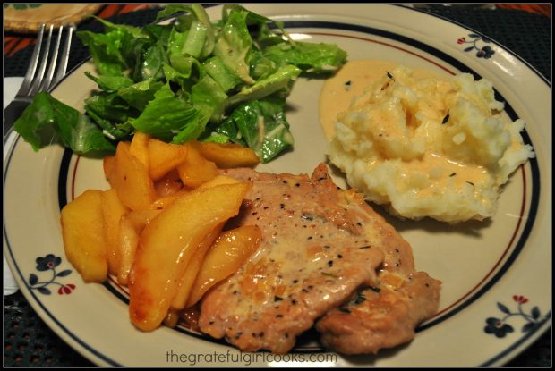 The pork tenderloin with apples is served with mashed potatoes and a salad.