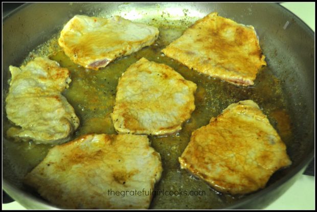 Pork cutlets are cooked on both sides in butter in a large skillet.