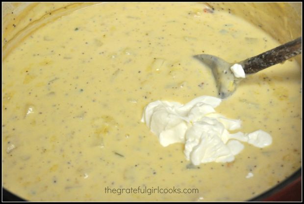 Sour cream is added to fully loaded potato soup just before serving.