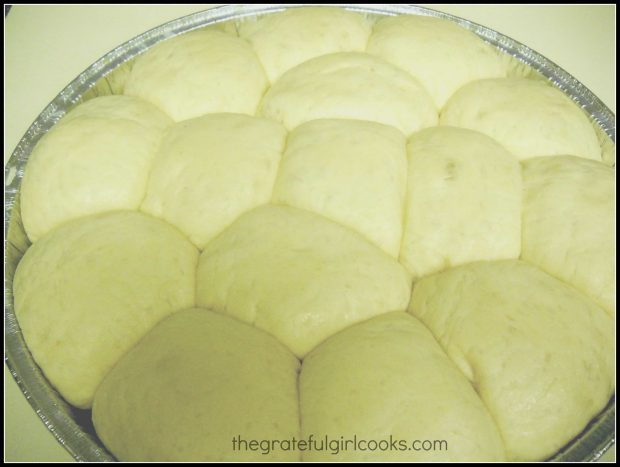 Dinner roll dough in a round pan, ready to bake!