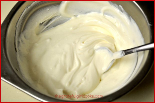 Mixing the sweetened sour cream topping up, for the chocolate fudge truffle cheesecake.