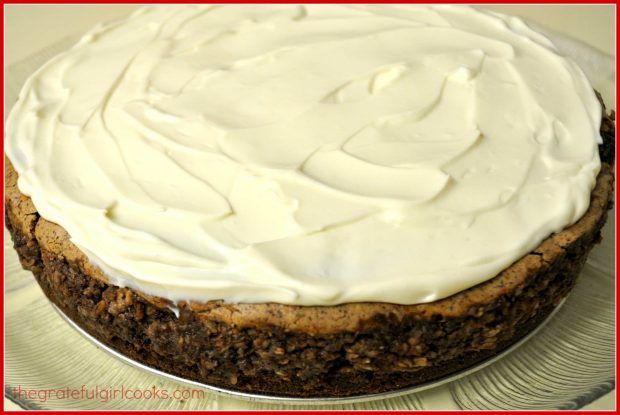 Sweetened sour cream layer is added to top of chocolate fudge truffle cheesecake, after baking.