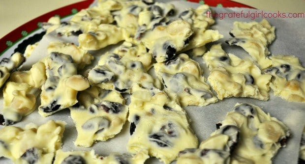 Cranberry cashew clusters on wax paper lined Christmas platter.
