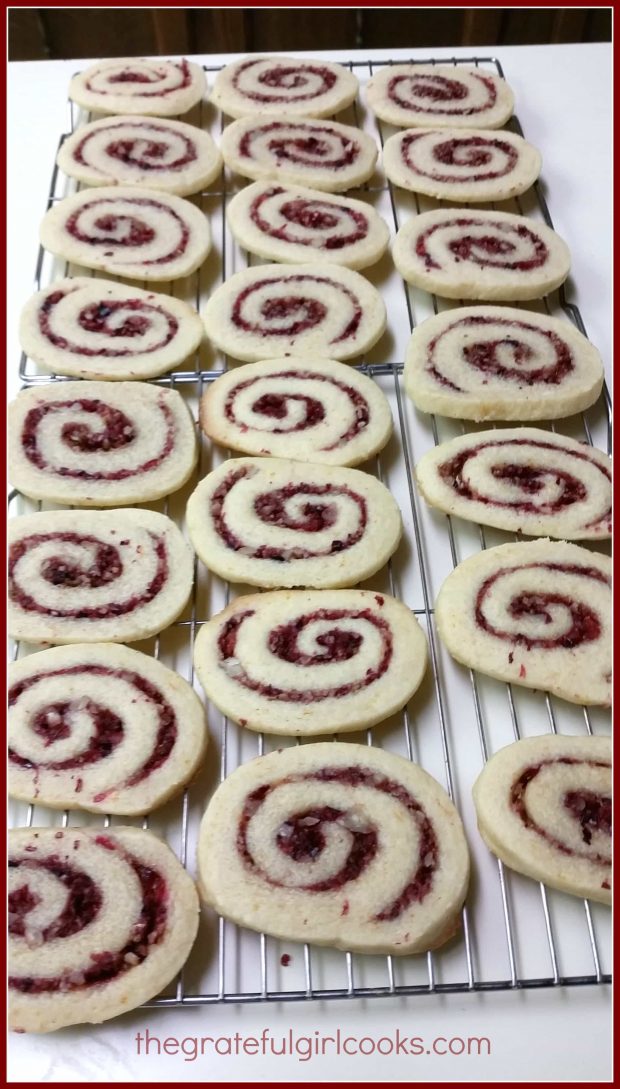 Baked Cranberry-Orange Pinwheel Cookies, cooling on wire racks.