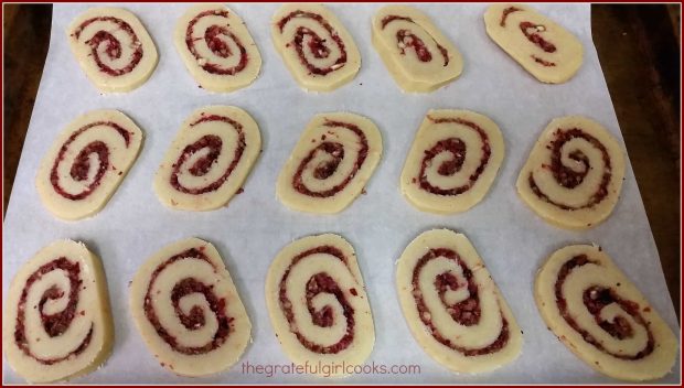 Cranberry-Orange Pinwheel Cookies, cut into 1/4" slices on baking sheet.