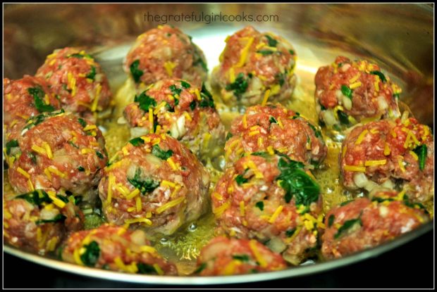 The BBQ Glazed Cheese & Spinach Meatballs cooking in a skillet.