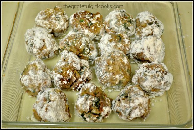 Flour coated meatballs in glass baking dish