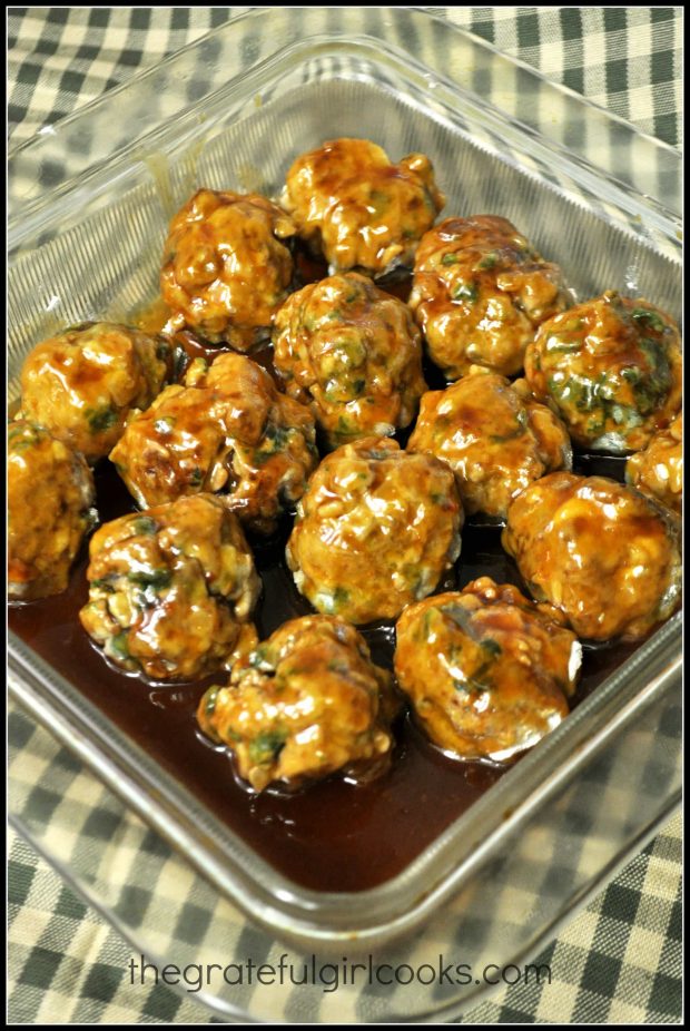 Sauce covering meatballs in dish