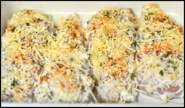 Chicken, covered with Parmesan cheese and spices