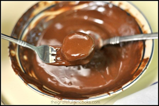 Melted semi-sweet chocolate is used to coat a frozen banana bite.