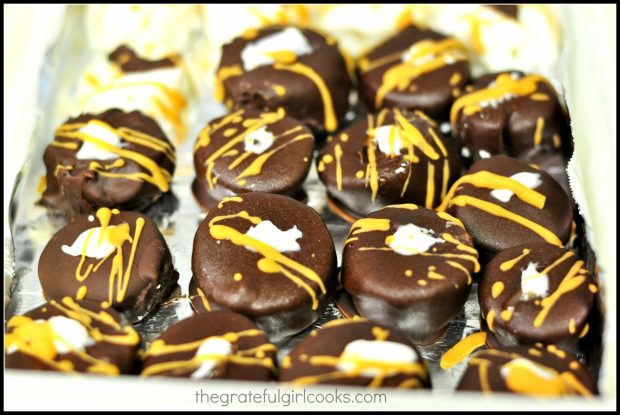 These frozen chocolate covered banana bites are drizzled with melted white chocolate and butterscotch chips.