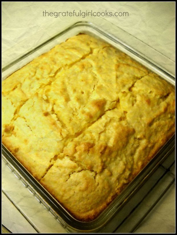 Golden brown baked cornbread is cut into 9 pieces.