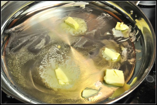 Olive oil and butter melting in skillet for coq au vin.