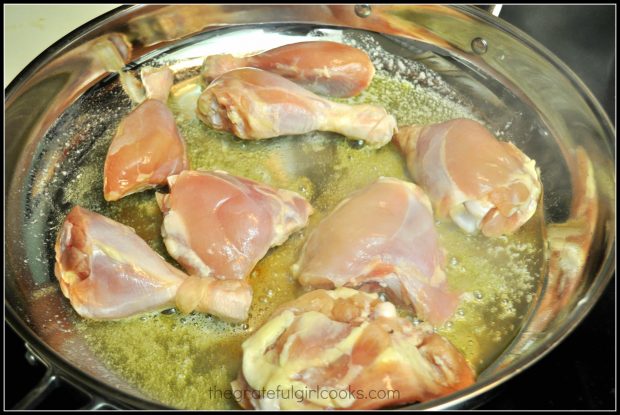 Chicken pieces are seared in olive oil and butter.