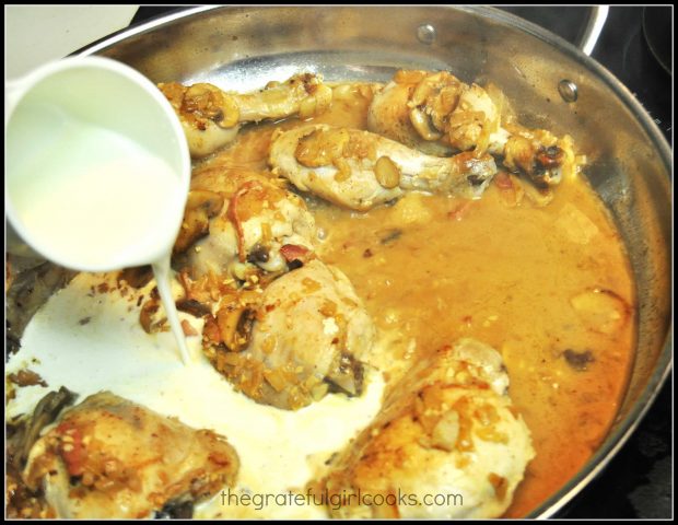 Whipping cream is added to coq au vin sauce.