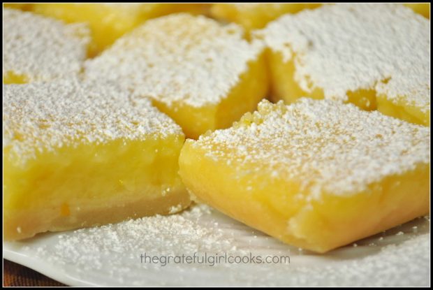 Close up of lemon bars on white plate