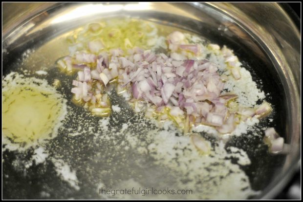 Chopped shallots cook in butter for cranberry sauce for pork tenderloin.