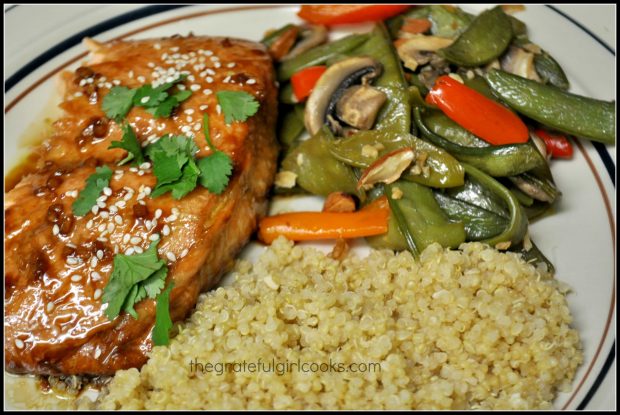 Sweet Ginger Teriyaki Salmon is served with veggies and quinoa on the side.