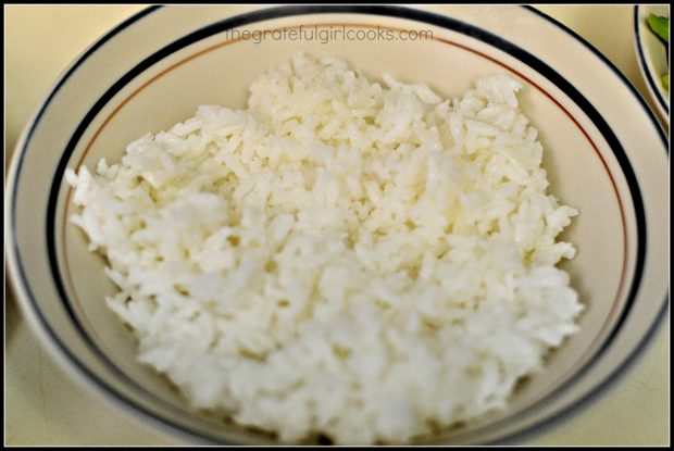 Steamed rice goes on the bottom of the teriyaki chicken rice bowl.