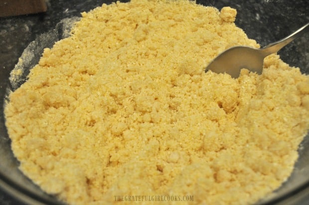 Oil or shortening has been added and now cornbread ingredients are crumbly.