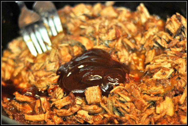 Shredding meat and bbq sauce for BBQ shredded pork hoagies with two forks