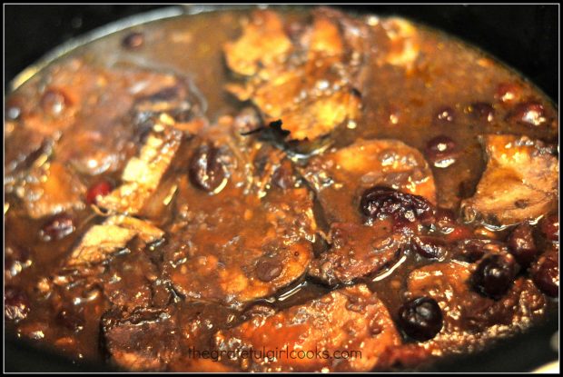 Pieces of pork for BBQ shredded pork hoagies, cooking in crock pot.