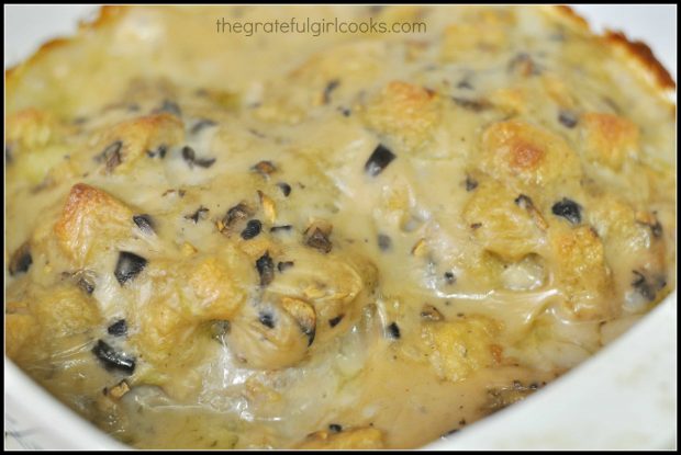 Bubbly sauce and stuffing on top of baked pork chops, right out of the oven.