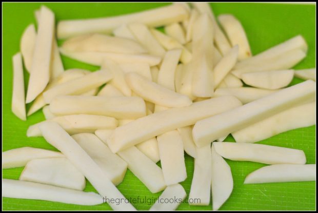 Potatoes are peeled, then sliced to make British style "chips"