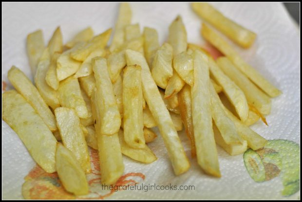 Fries are drained after first cooking