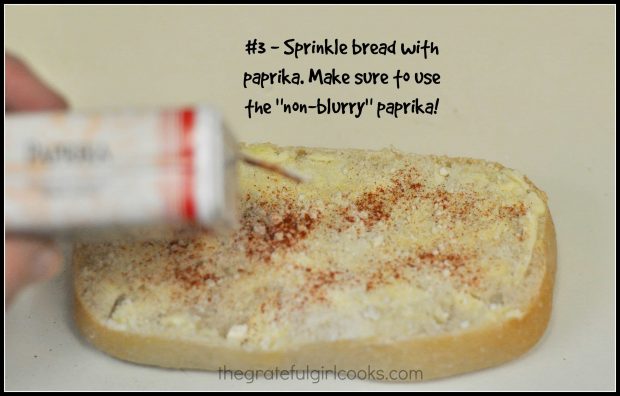 Garlic bread is sprinkled lightly with paprika.