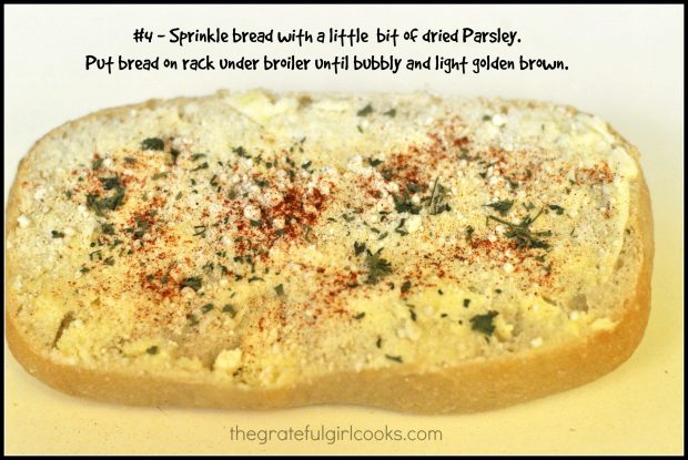 Garlic bread is sprinkled with dried parsley flakes.