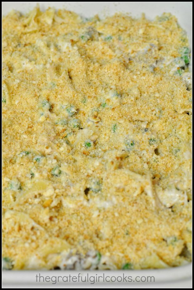 Buttery cracker crumbs are spread on top of tuna noodle casserole before baking.