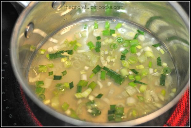 Wine, lemon juice and green onions are cooked for sauce