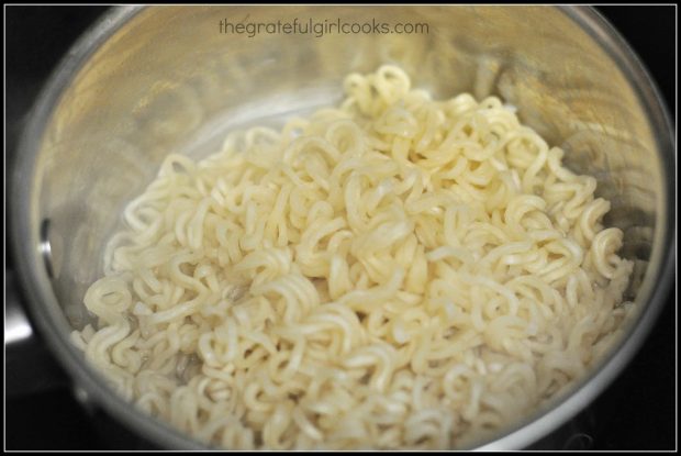 Ramen noodles are cooked in boiling water for 3 minutes, then drained.