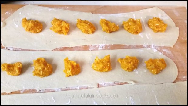 Roasted squash is placed on sheets of pasta dough in dollops.
