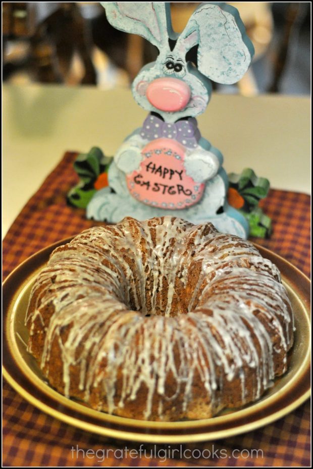 Hummingbird Cake on platter, with Easter bunny behind it