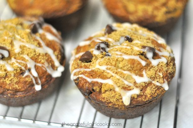 Muffins are drizzled with vanilla glaze after baking.