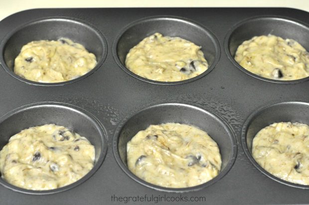 Muffin cups are filled with the batter.