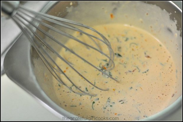 Whisking salad dressing ingredients for Southwestern cobb salad.